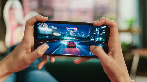 Mobile gaming demonstration shown on a smartphone screen during a technology showcase